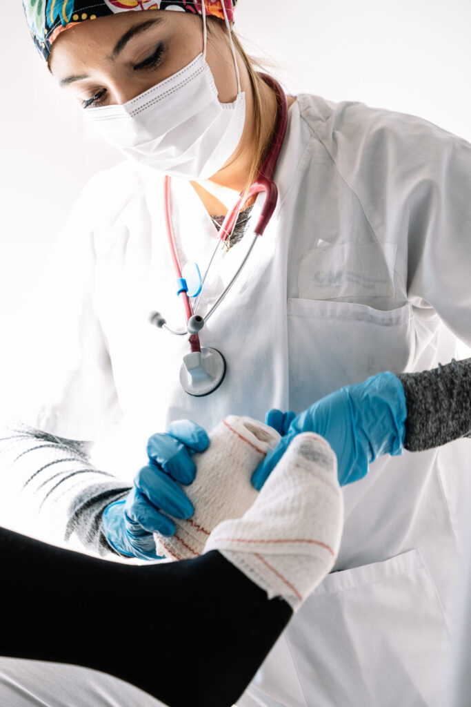 Home Nurse Bandaging Leg Of Patient 2024 11 29 11 26 43 Utc Scaled 1 683x1024