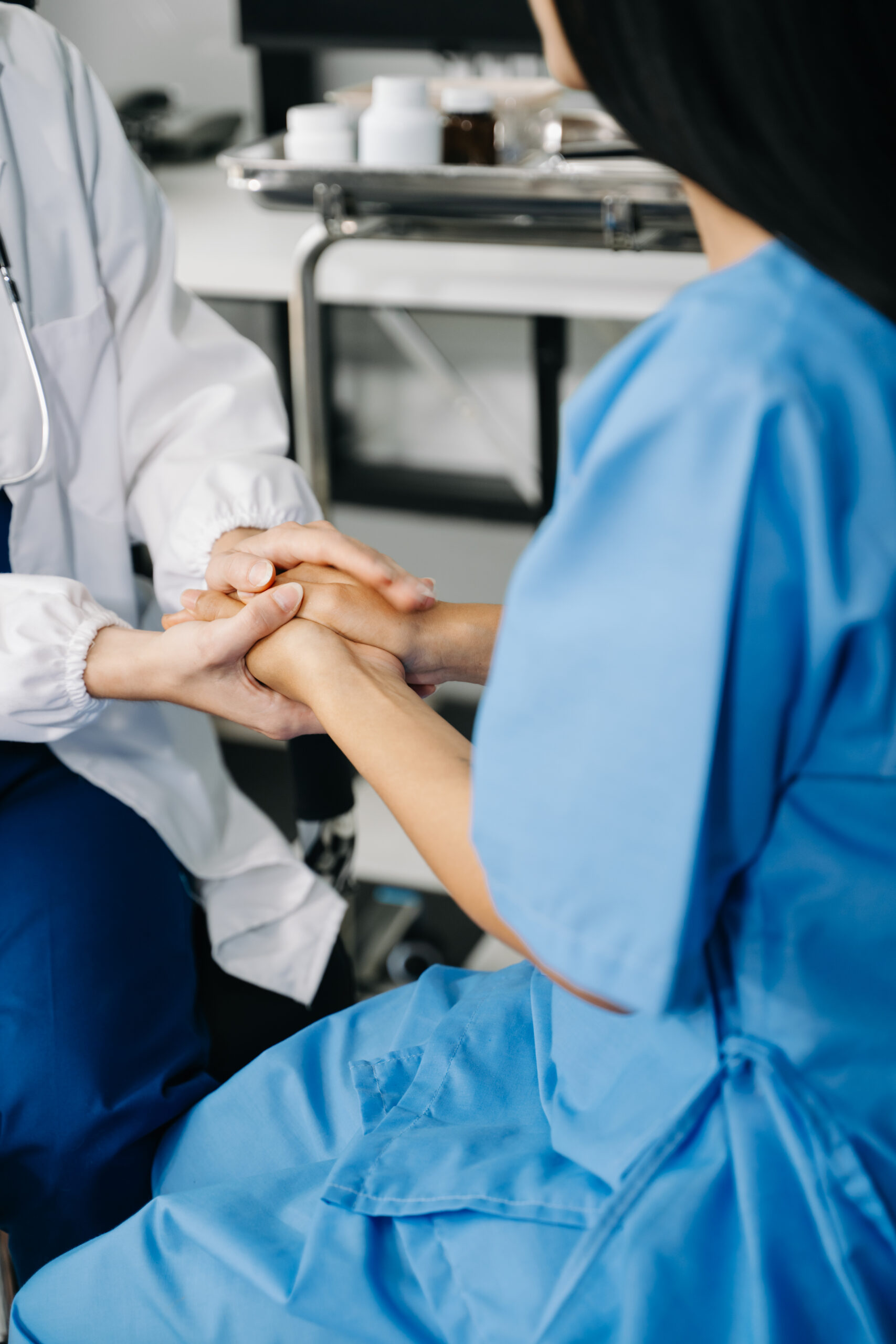 the doctor holds the patient’s. hand healthcare and medical co the doctor holds the patient’s. hand healthcare and medical co